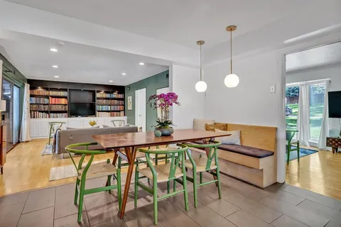 a view of a dining room kitchen tables and chairs