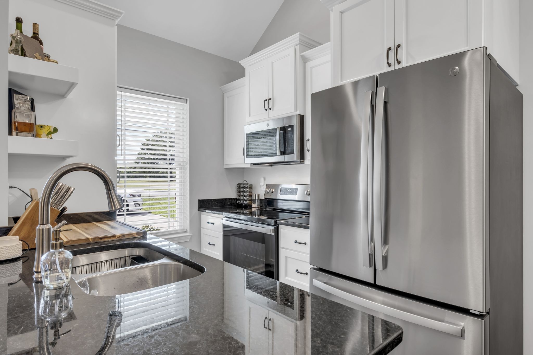 106 Eno Road Dickson, TN 37055 - Photo 8 of 21 a kitchen with granite countertop a refrigerator stove and sink