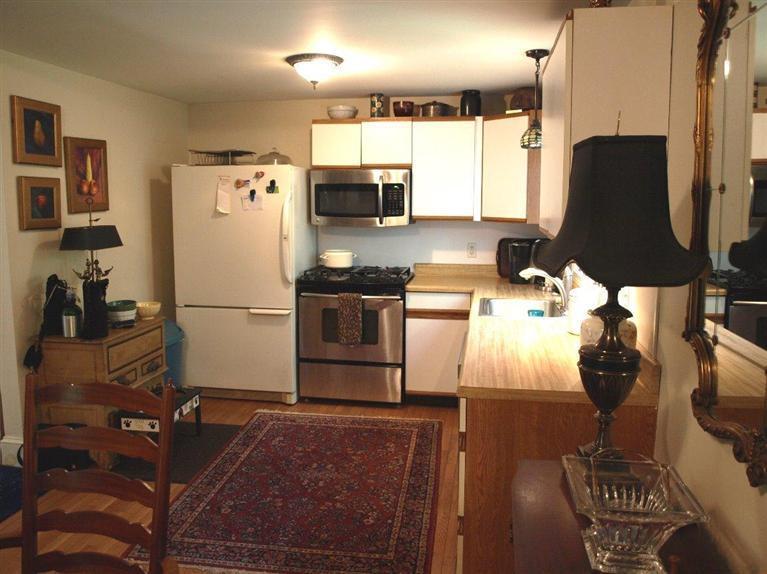 86 Shore Road, Unit 15 Truro, MA 02666 - Photo 20 of 23 a kitchen with stainless steel appliances granite countertop a refrigerator and a stove top oven