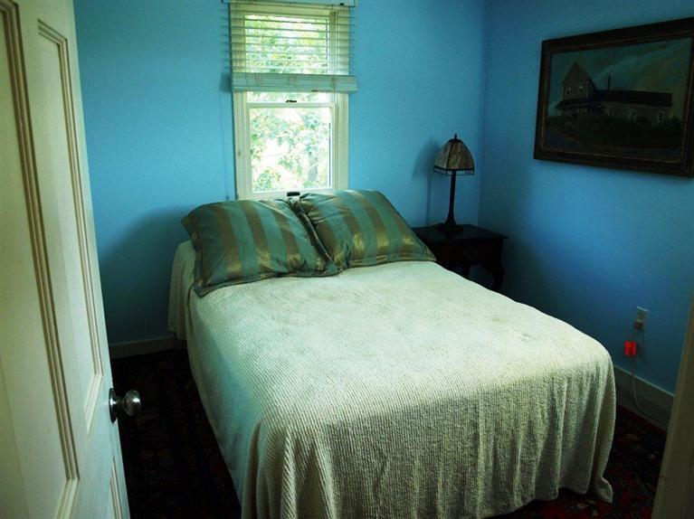 86 Shore Road, Unit 15 Truro, MA 02666 - Photo 22 of 23 a bed sitting in a bedroom next to a window