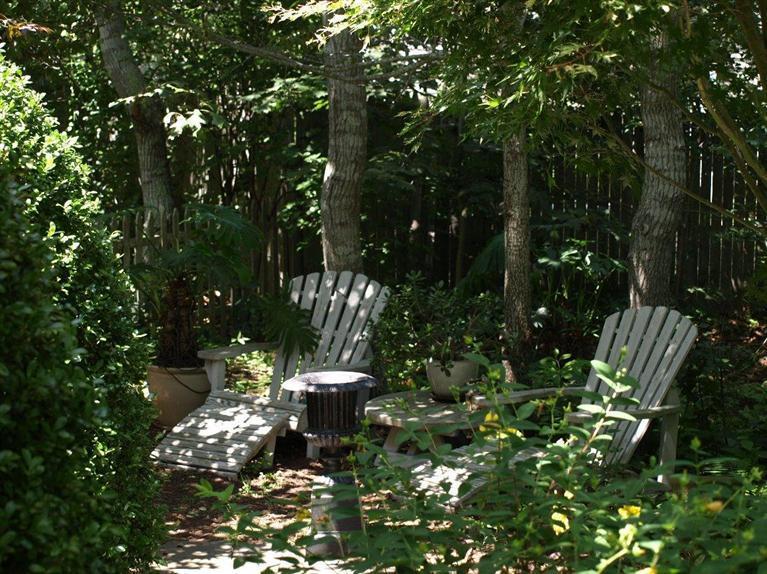 86 Shore Road, Unit 15 Truro, MA 02666 - Photo 5 of 23 a view of a backyard with sitting area