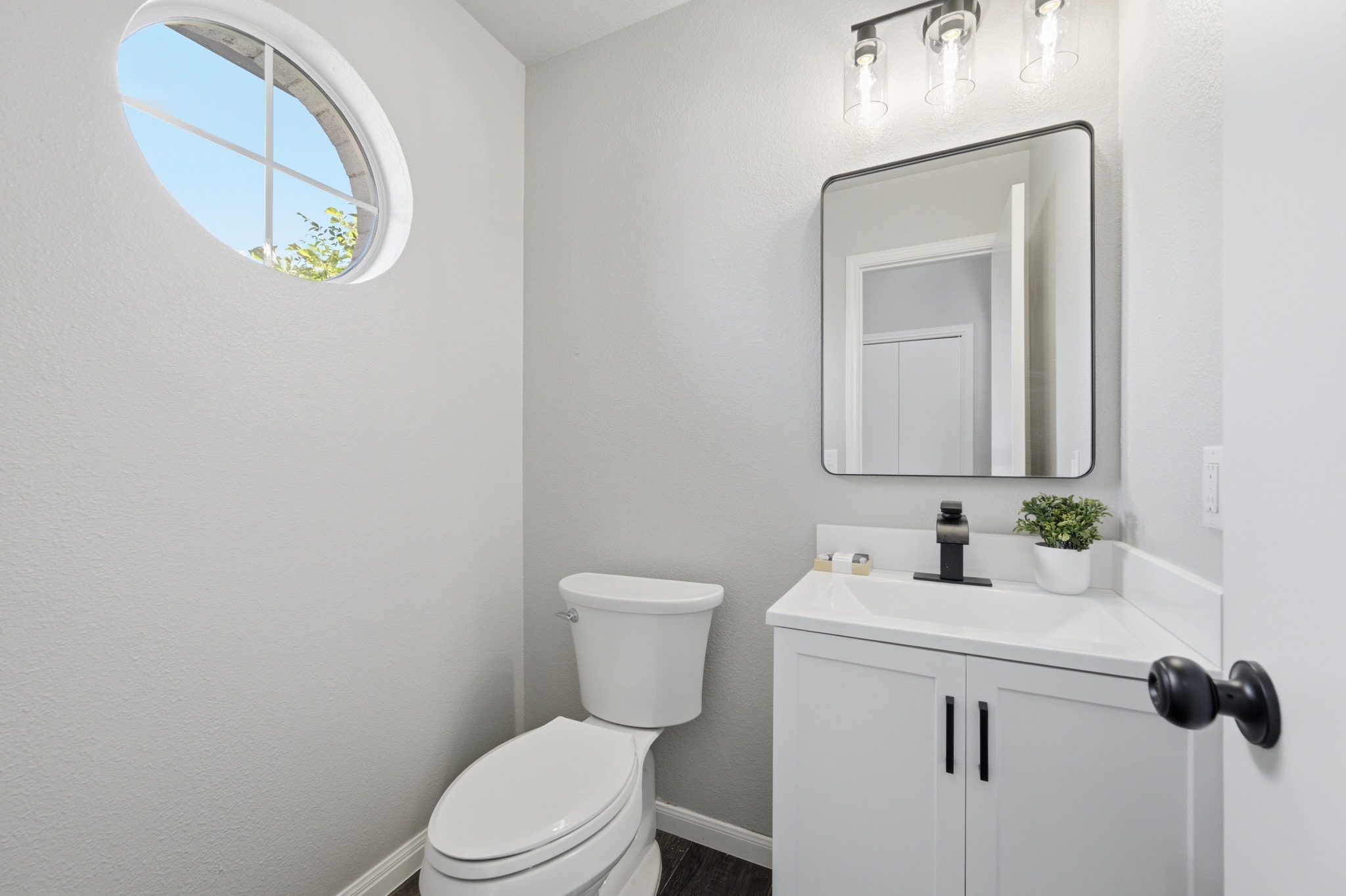 1504 Waterfall Avenue Leander, TX 78641 - Photo 12 of 25 The downstairs powder bath gets a little extra charm from the round accent window.