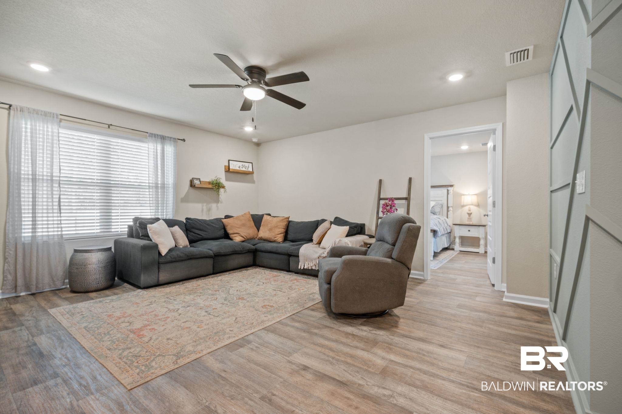 10306 Brodick Loop Spanish Fort, AL 36527 - Photo 4 of 35 Living room with light wood-type flooring and ceiling fan