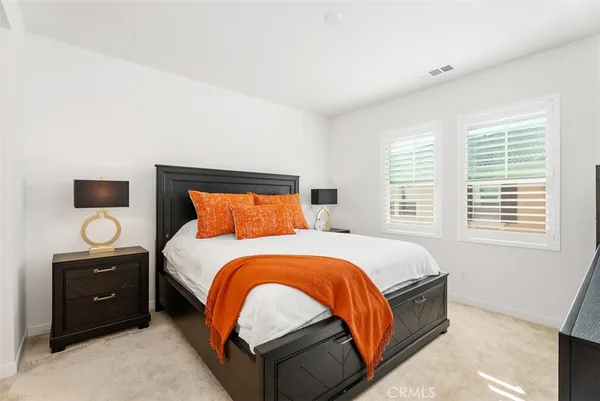 a bedroom with a bed and dresser