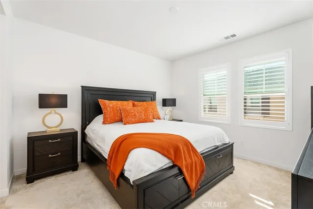 a bedroom with a bed and dresser