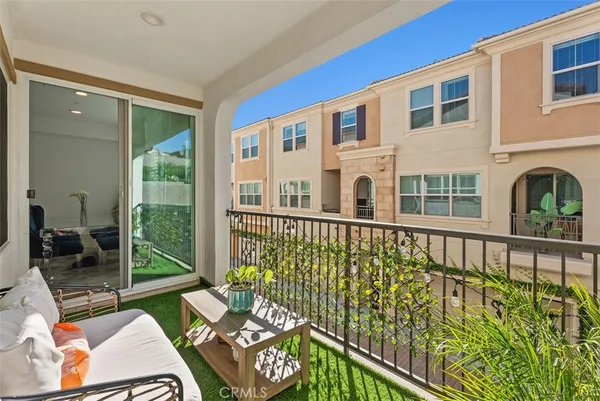 a view of a balcony with chairs