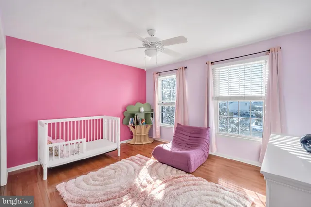 a spacious bedroom with a bed and a window