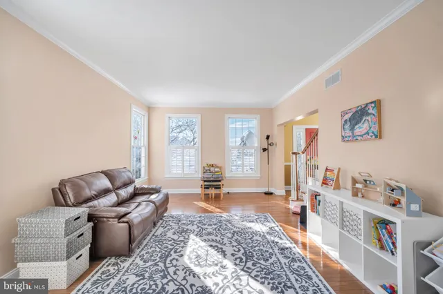 a living room with furniture and a rug