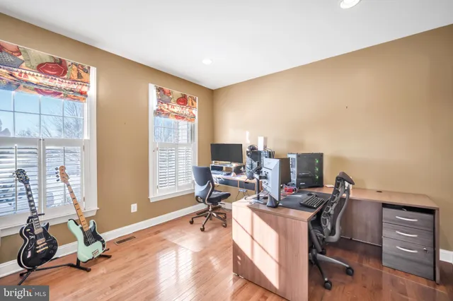 a workspace with furniture and a window