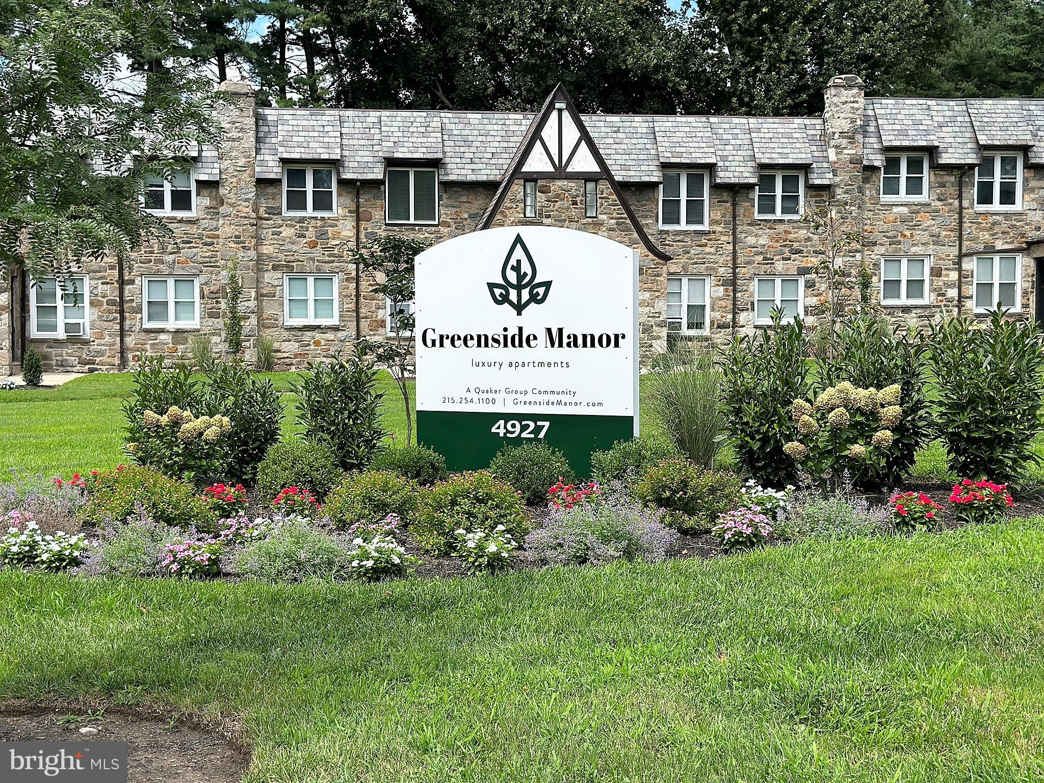 4927 Wynnefield Avenue, Unit 17A Philadelphia, PA 19131 - Photo 1 of 24 a view of a house with a garden and signage