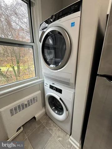 a kitchen with stainless steel appliances a sink a stove and cabinets