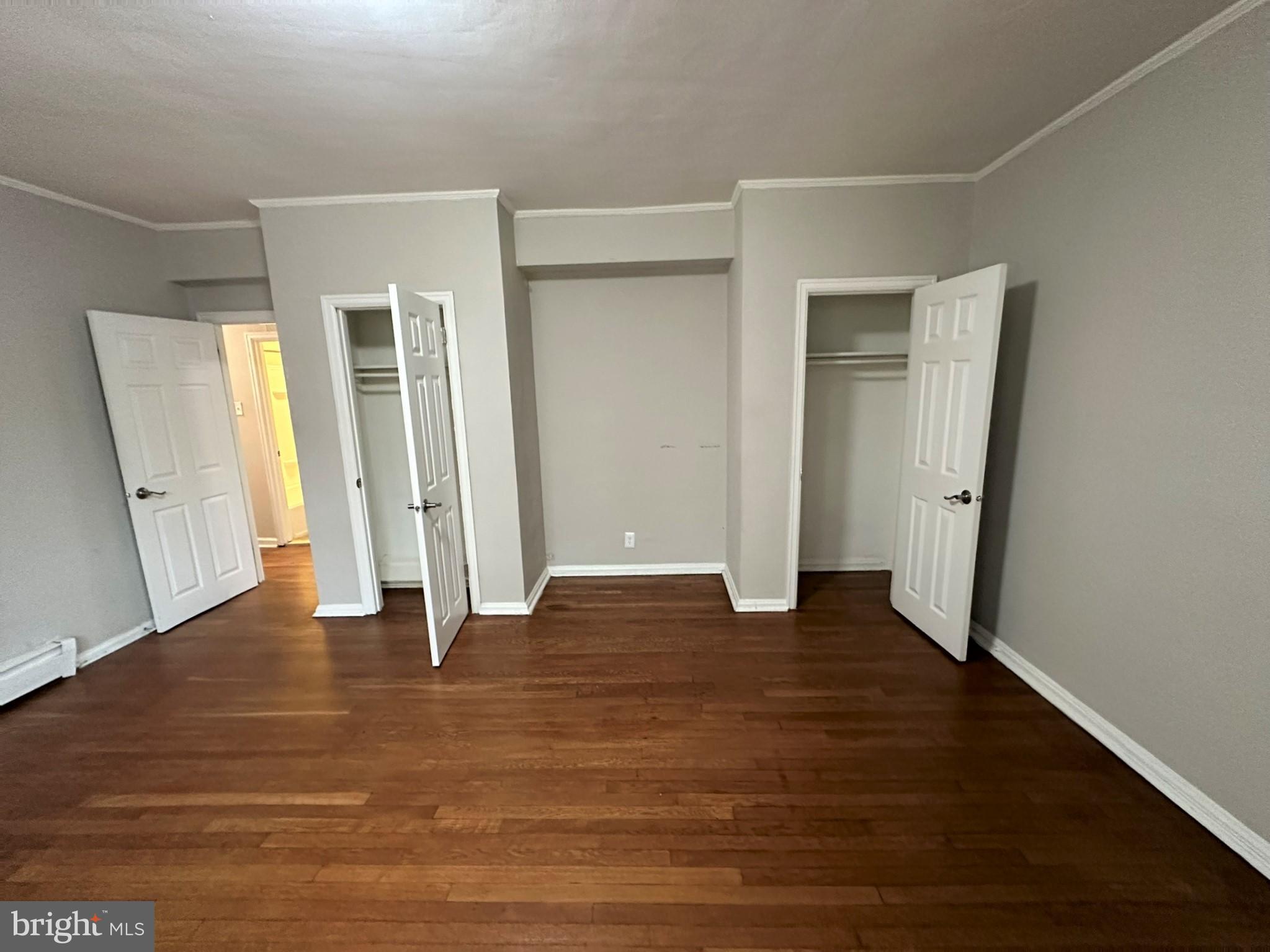 4927 Wynnefield Avenue, Unit 17A Philadelphia, PA 19131 - Photo 19 of 24 an empty room with wooden floor and entrance