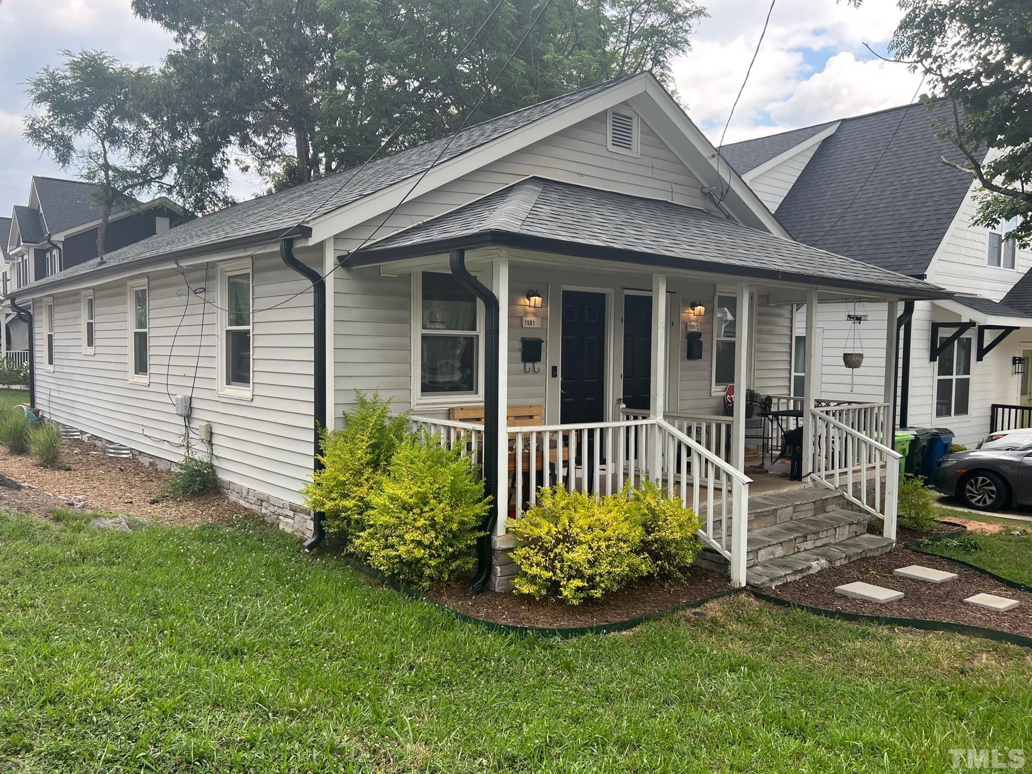 1501 Pender Street Raleigh, NC 27610 - Photo 2 of 8 a front view of a house with a garden
