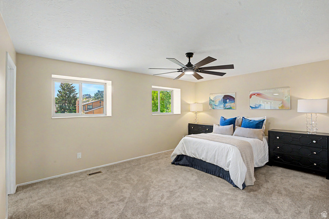 1933 Rua Branco Drive, Unit 107 Sandy, UT 84093 - Photo 12 of 20 Spacious primary bedroom dual windows create natural lighting with Mountain Views,