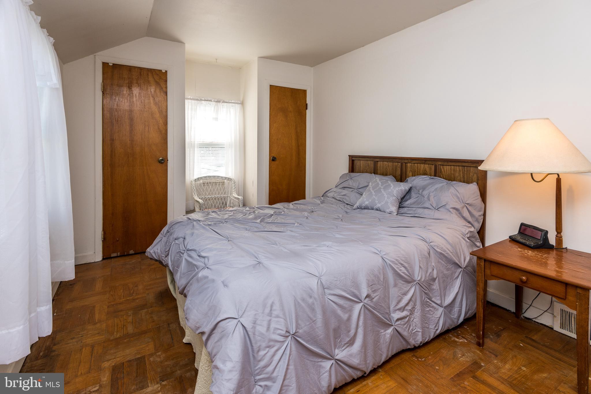 1228 Cambridge Road Warminster, PA 18974 - Photo 14 of 23 a bedroom with a bed and a lamp