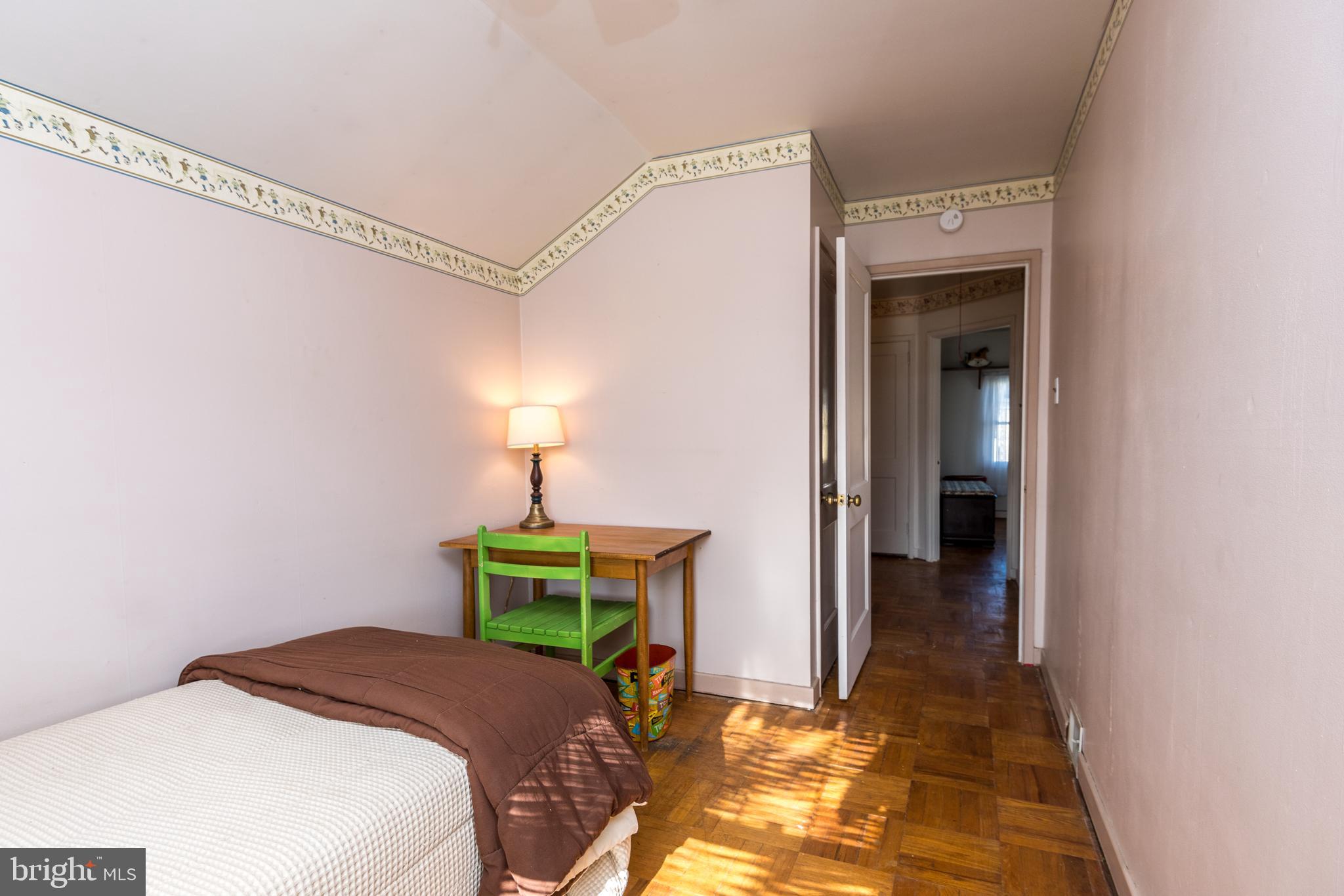 1228 Cambridge Road Warminster, PA 18974 - Photo 18 of 23 a bedroom with a bed and a chandelier