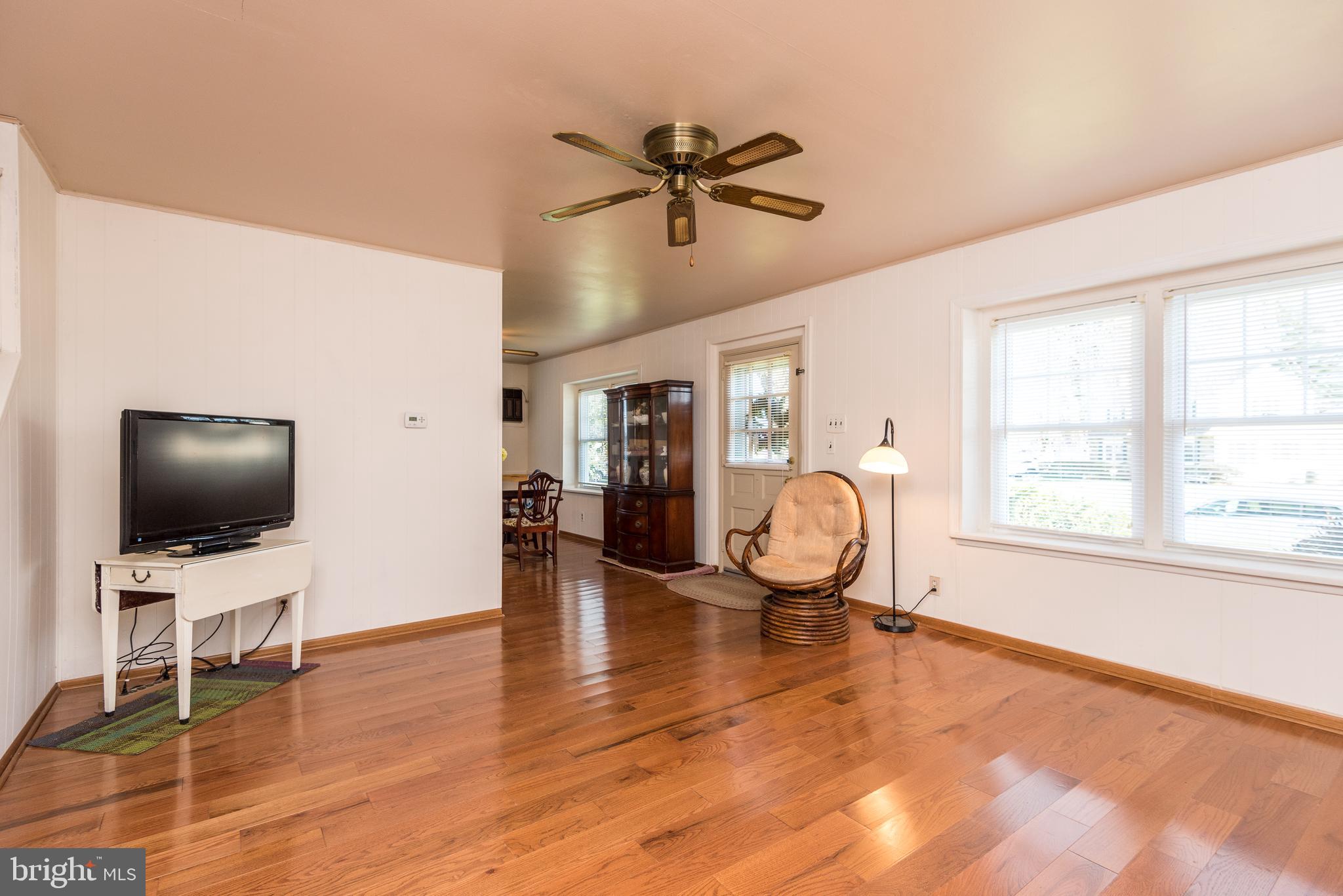 1228 Cambridge Road Warminster, PA 18974 - Photo 3 of 23 a living room with furniture and a flat screen tv