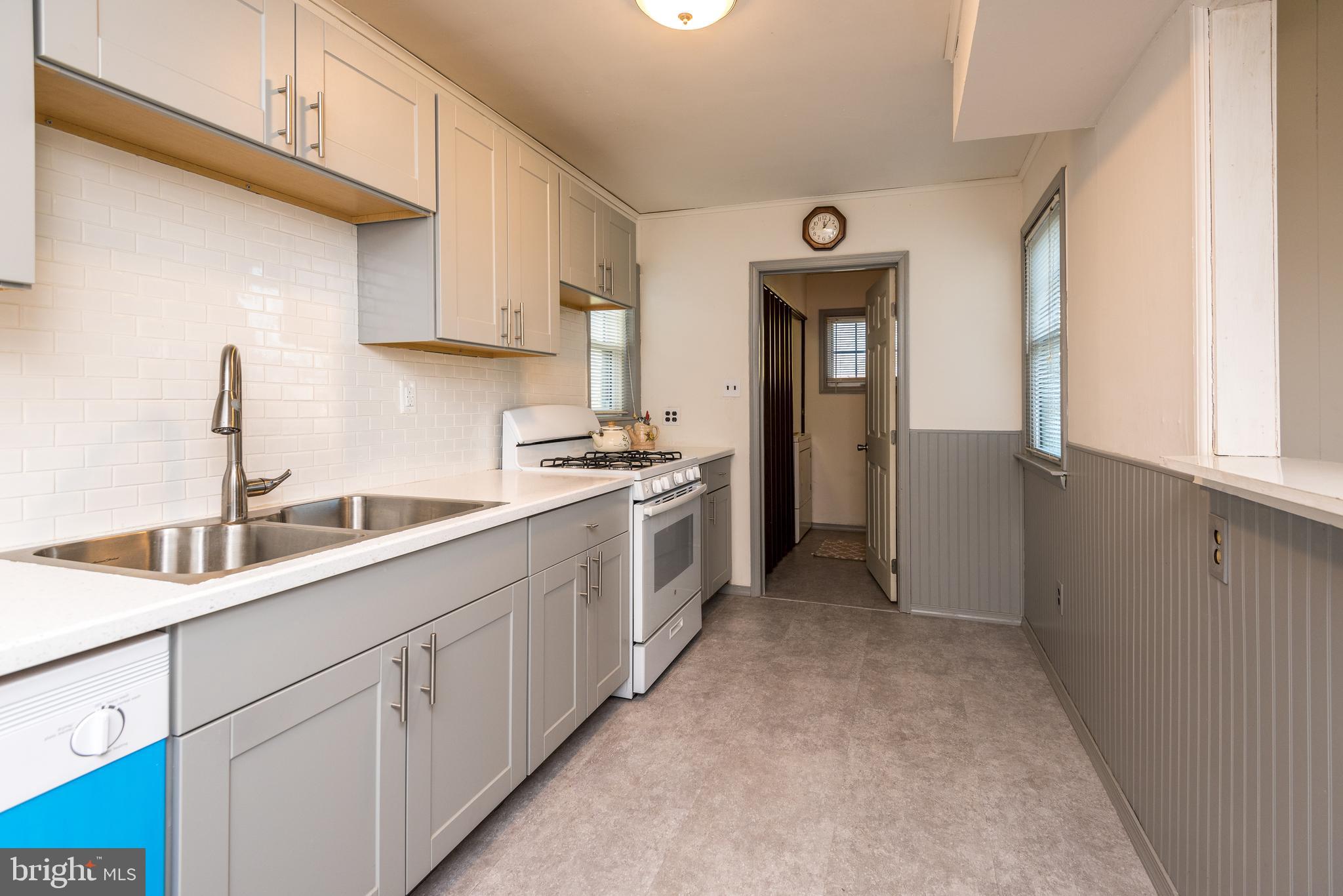 1228 Cambridge Road Warminster, PA 18974 - Photo 8 of 23 a kitchen with a sink cabinets and window