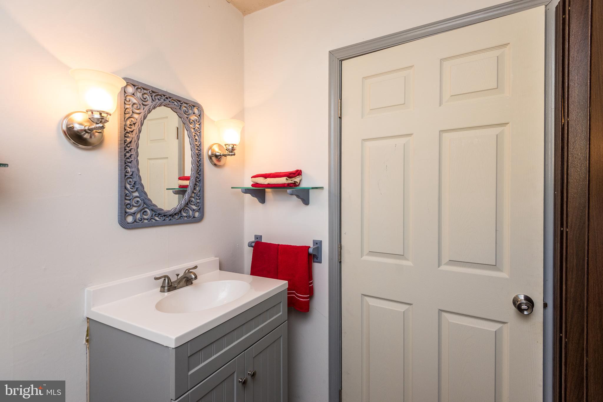 1228 Cambridge Road Warminster, PA 18974 - Photo 10 of 23 a bathroom with a sink vanity and a mirror