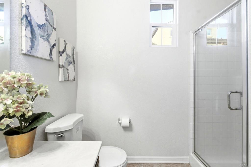 1508 Carpinteria Street Chula Vista, CA 91913 - Photo 13 of 39 a white toilet sitting next to a shower