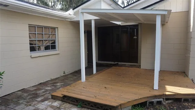 a wooden door in front of a house