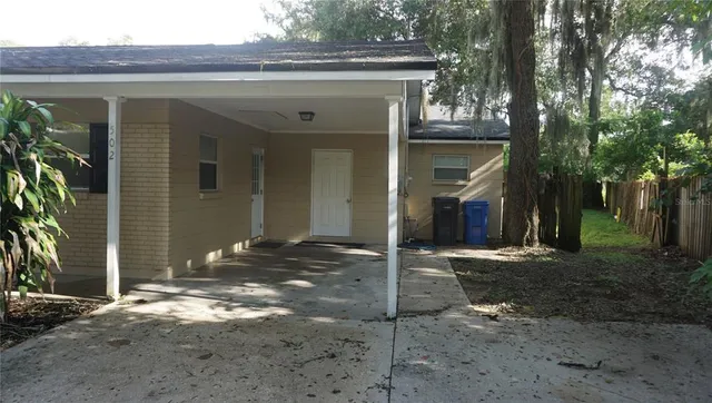 a view of a house with a small yard