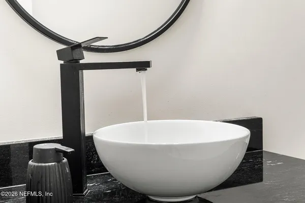 a white bath tub sitting in a bathroom