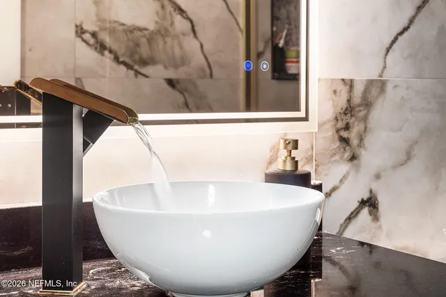 a white bath tub sitting in a bathroom