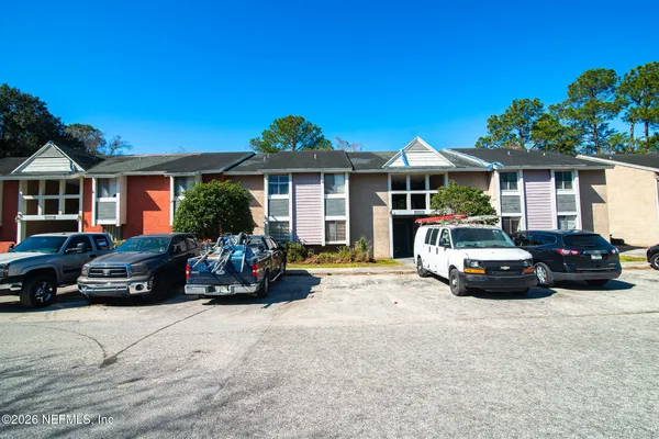 a view of a car parked in front of a house