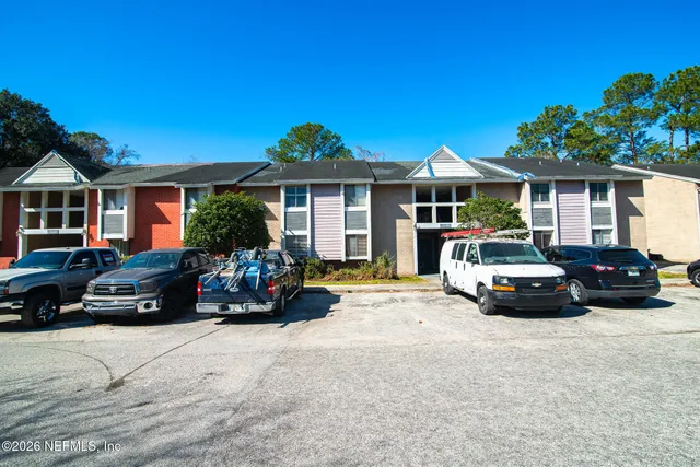 a view of a car parked in front of a house