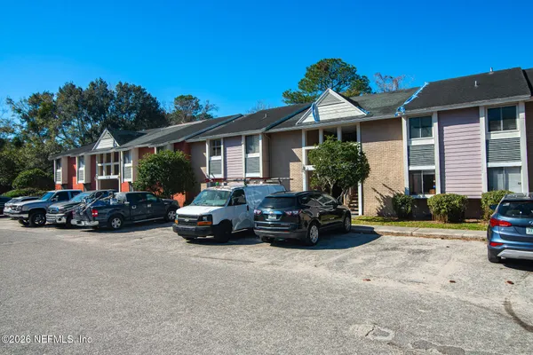 a view of a car parked in front of a house