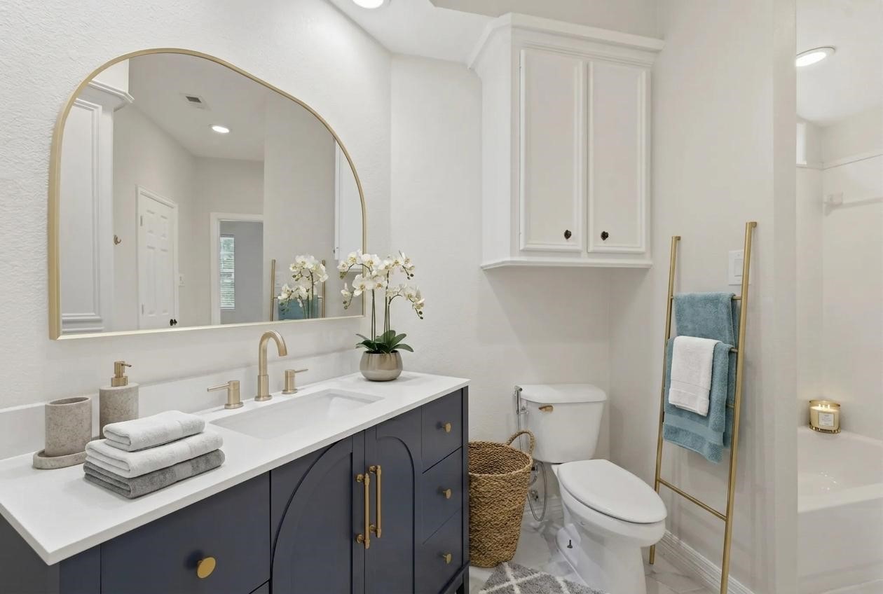 3315 Riviera Drive Sugar Land, TX 77479 - Photo 32 of 42 a bathroom with a granite countertop sink mirror and toilet