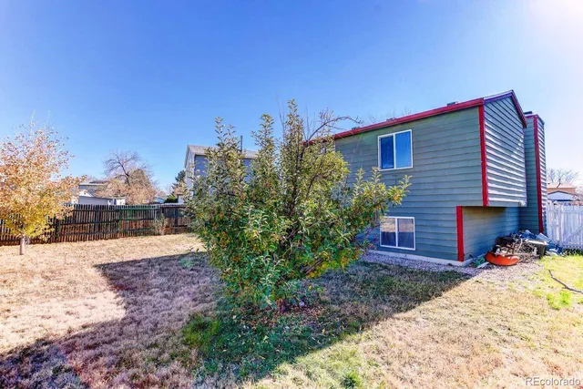 a view of a backyard of the house