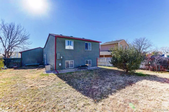 a view of a backyard of the house