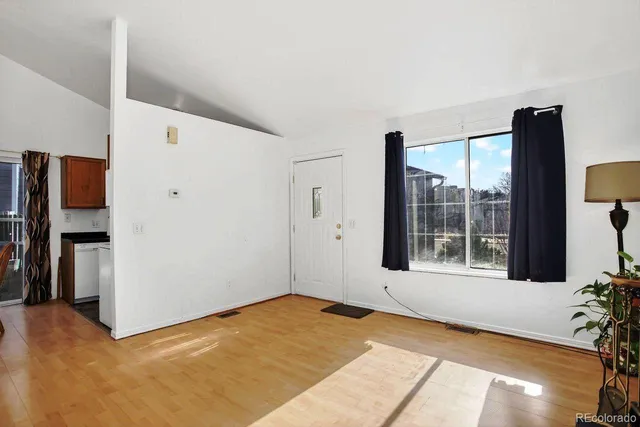 a view of an empty room with a window