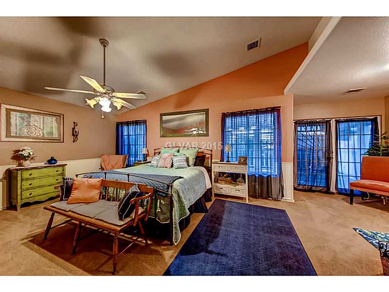 161 West Rochell Drive Henderson, NV 89015 - Photo 23 of 35 Master Bedroom. Your Master retreat supports a massive covered patio and looks out on to your private pool and play yard!!