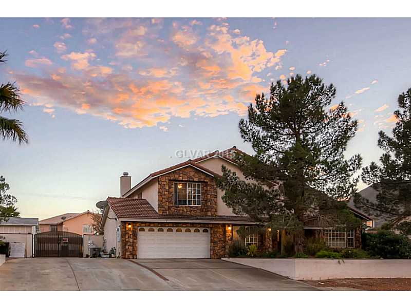 Facade/Exterior Front. This custom home sits on over 1/3 acre parcel and supports separate RV parking to boot!