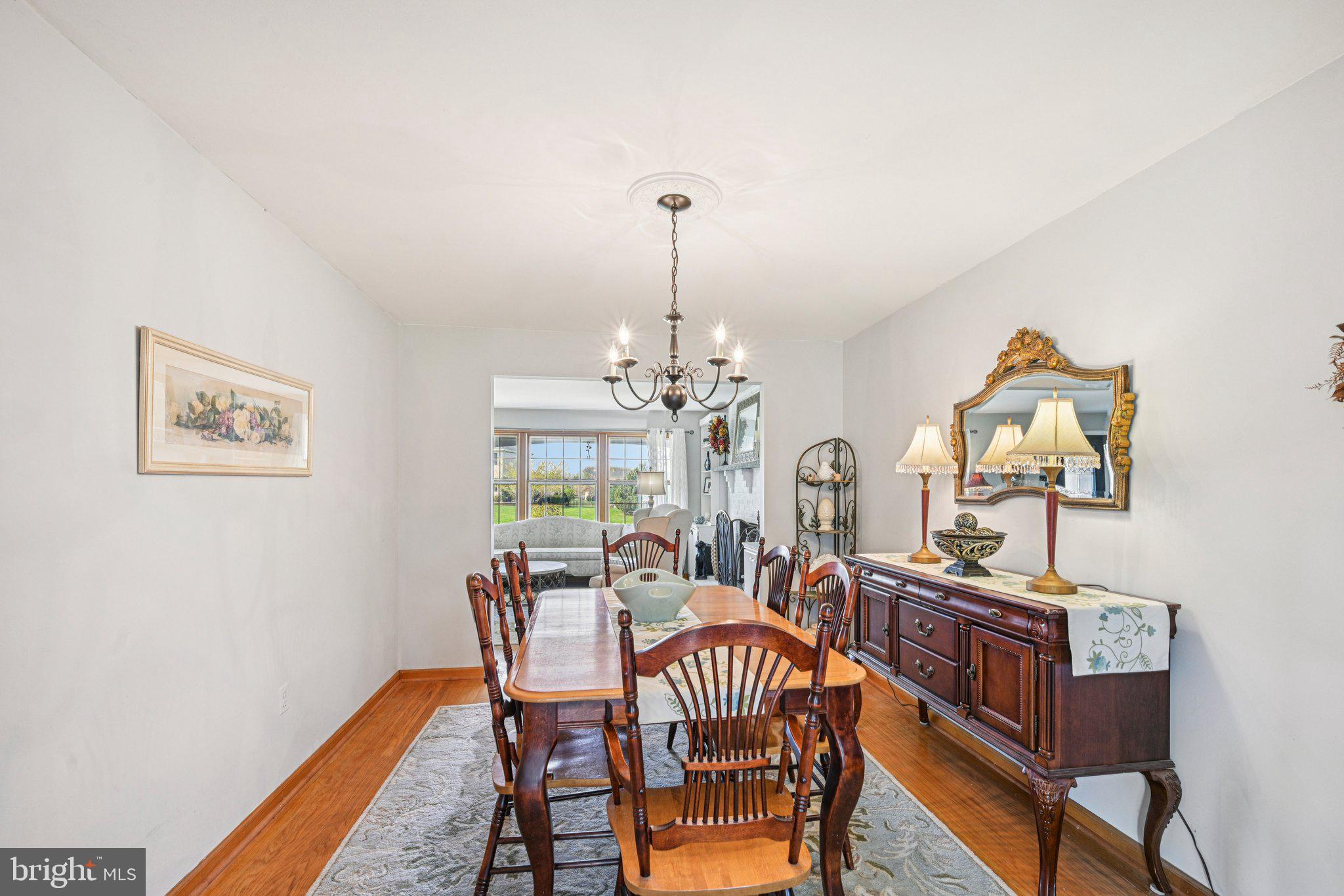 25618 Mt Pleasant Road Columbus, NJ 08022 - Photo 14 of 61 a view of a dining room with furniture window and wooden floor