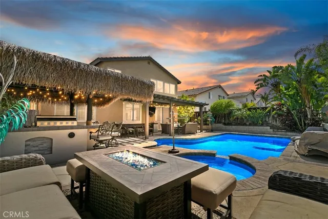 a view of a patio with swimming pool table and chairs