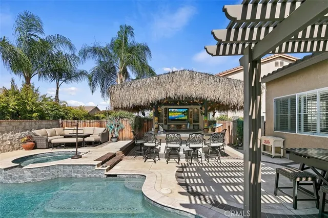 a view of a chairs and table in patio