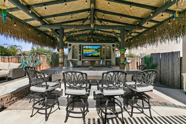 a view of a chairs and table in a patio