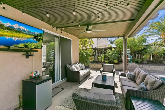 a patio with patio couch and chairs