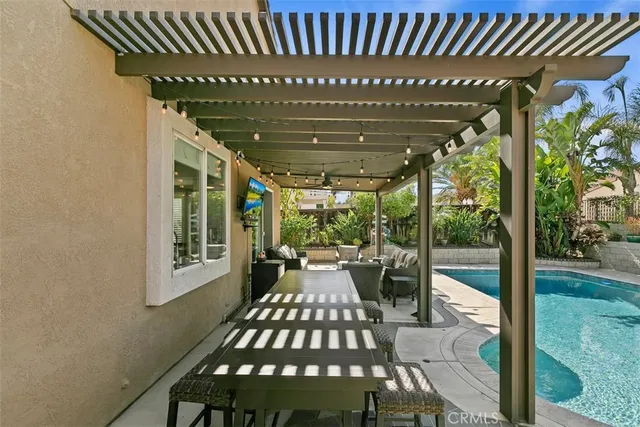 a view of a porch with furniture and yard