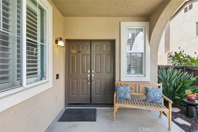 a view of a room with a window and chair