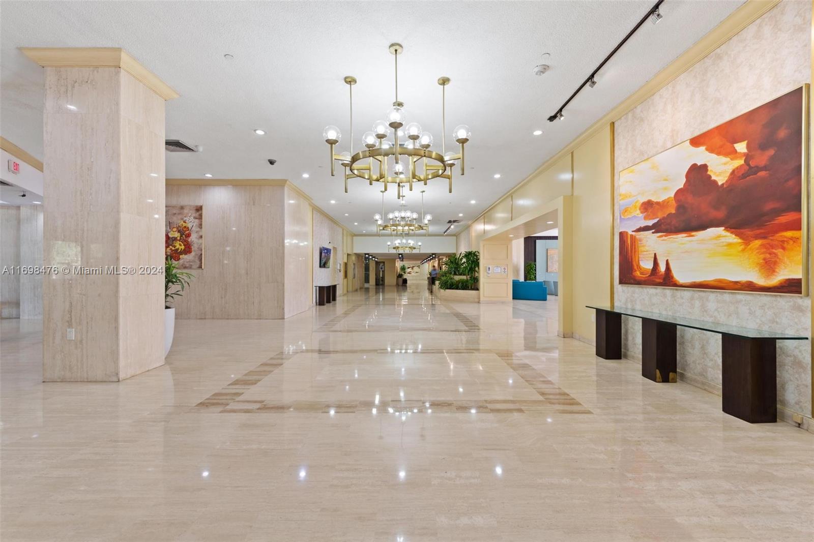 4101 Pine Tree Drive, Unit 1702 Miami Beach, FL 33140 - Photo 28 of 51 a view of a lobby with furniture and a chandelier