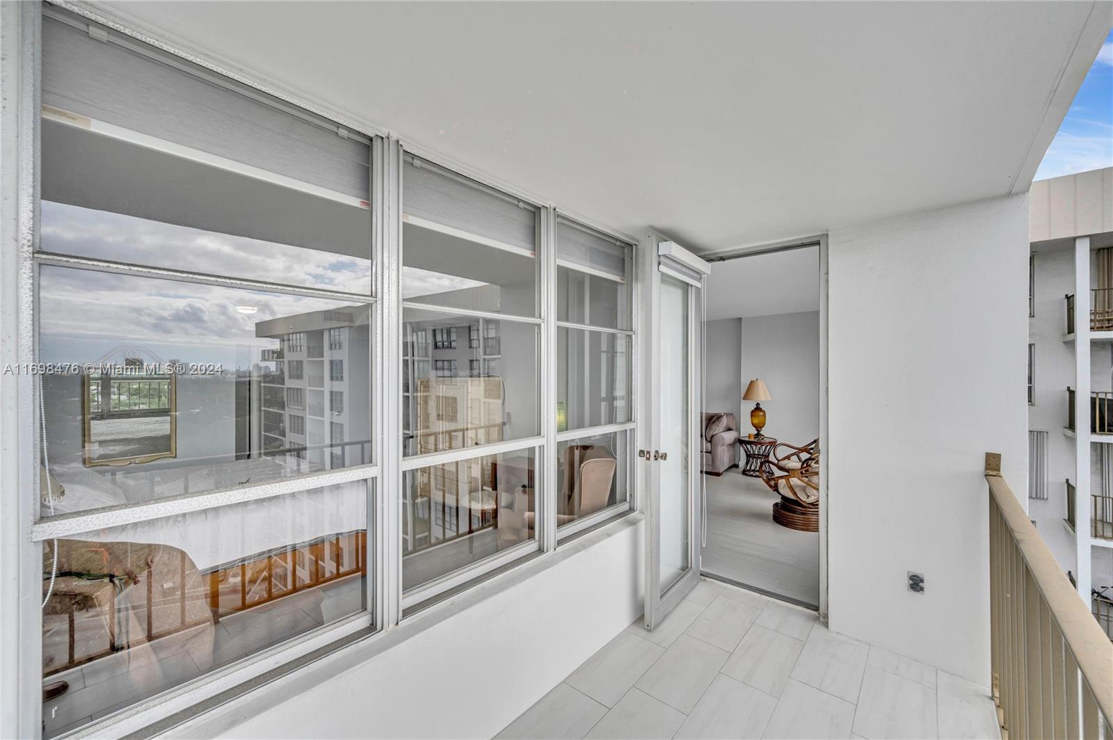 4101 Pine Tree Drive, Unit 1702 Miami Beach, FL 33140 - Photo 5 of 51 hallway with windows