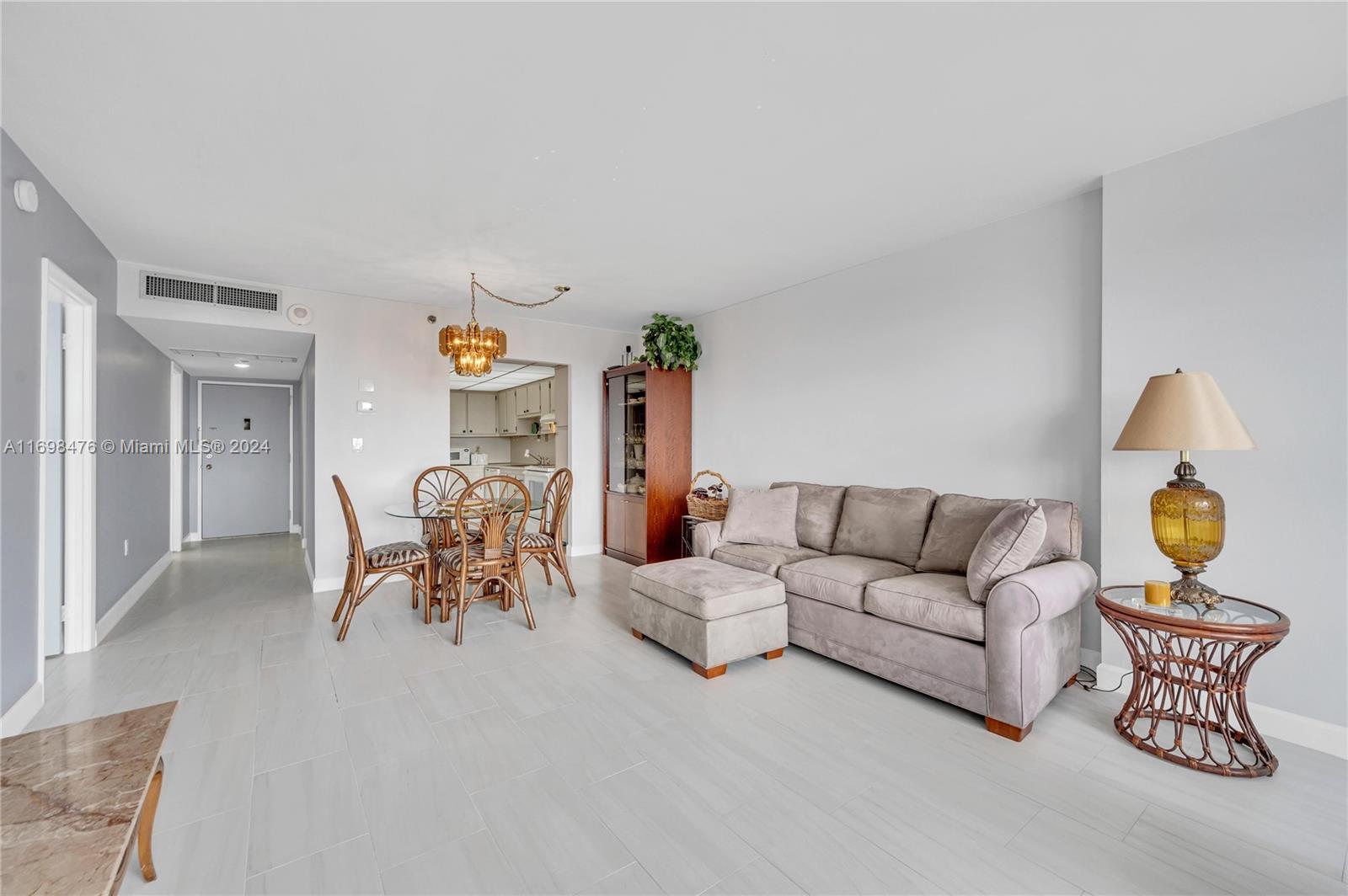 4101 Pine Tree Drive, Unit 1702 Miami Beach, FL 33140 - Photo 9 of 51 a living room with furniture and a couch