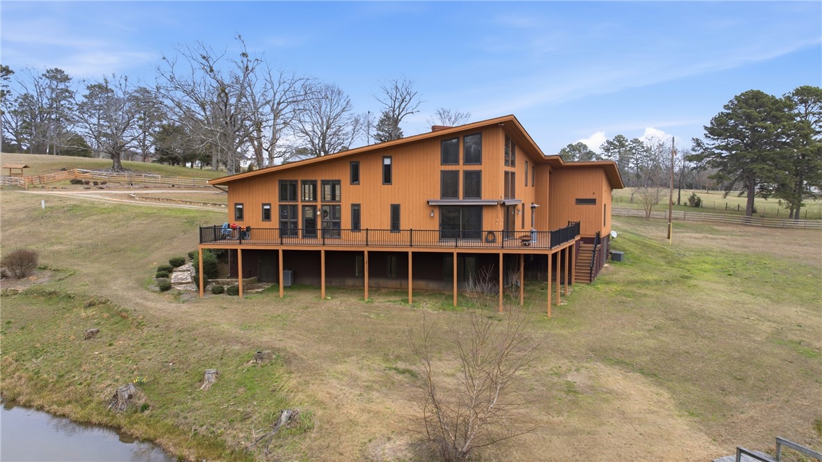 1531 Highway 252 Laurens, SC 29360 - Photo 26 of 40 Perched on a verdant hillside, this expansive residence offers sweeping views and a serene connection to nature.