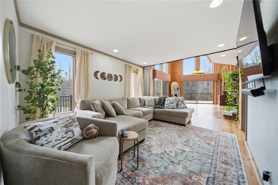 1531 Highway 252 Laurens, SC 29360 - Photo 8 of 40 This bright living space features towering windows and warm wood details, perfect for relaxed gatherings.