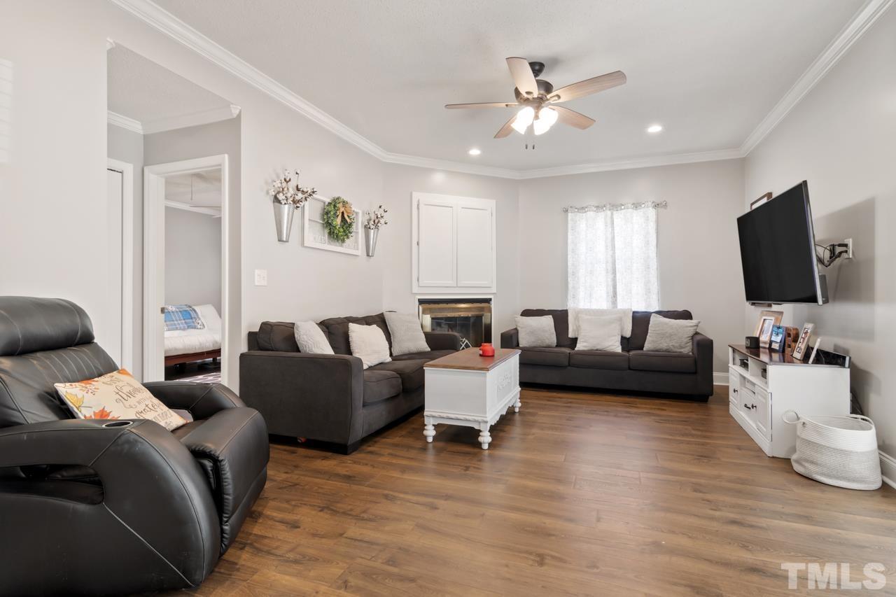 6908 Kiger Road Rougemont, NC 27572 - Photo 14 of 30 a living room with furniture flat screen tv and couches